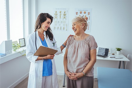 Female doctor and older female patient