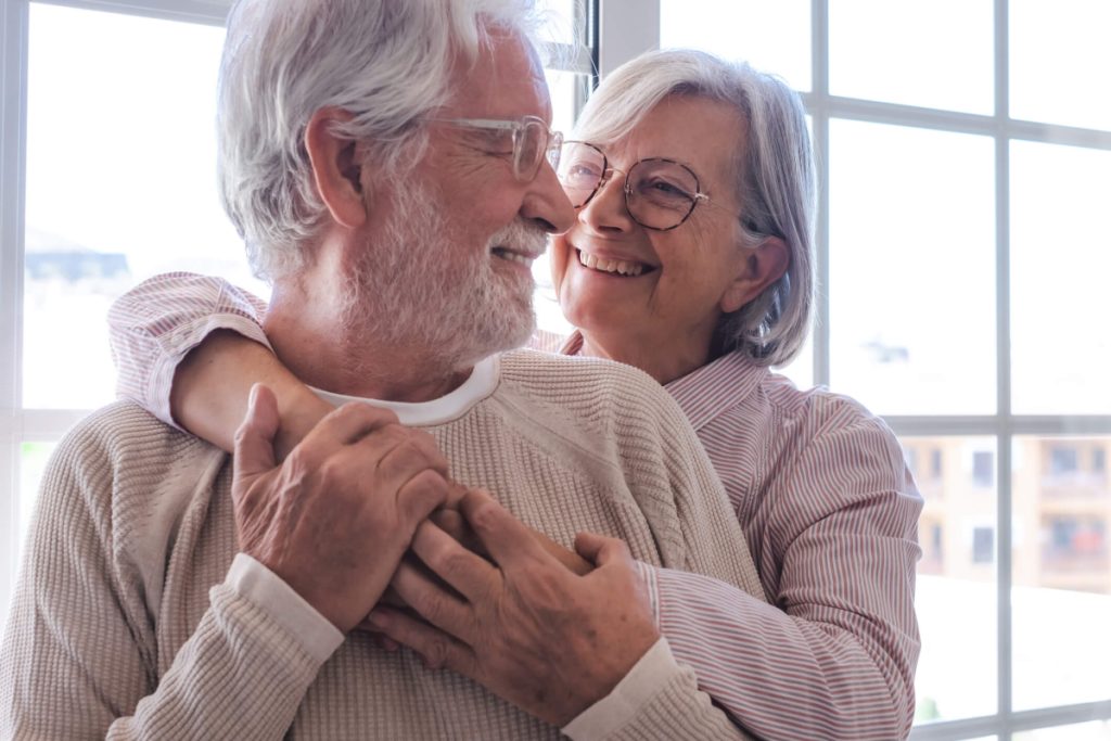 How assisted living improves quality of life elder couple holding each other