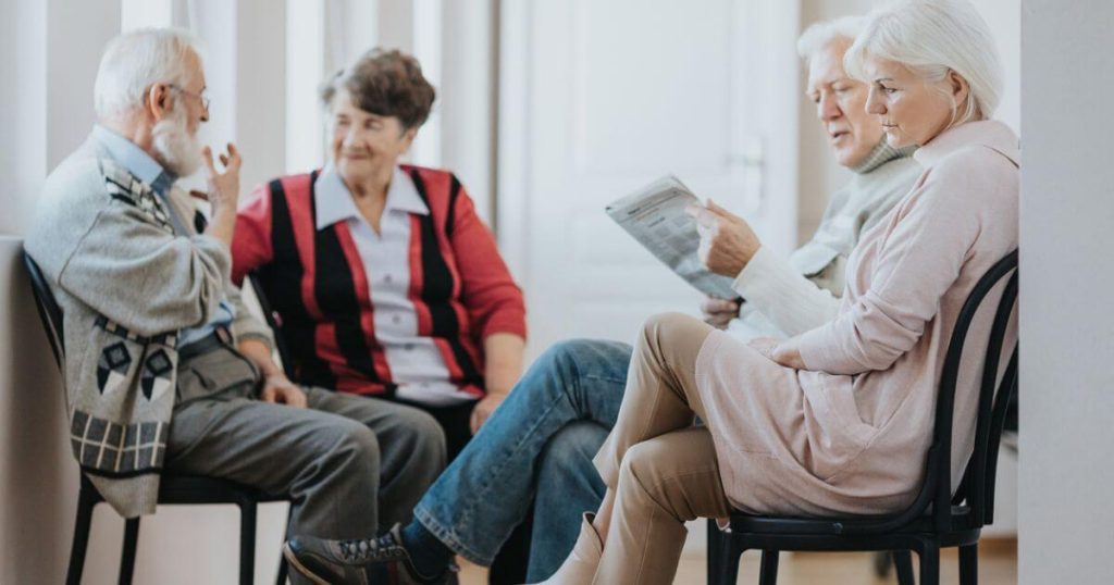 Group of two senior couples avoiding isolation in seniors.